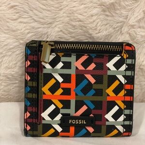 Small fossil wallet. Multi colour, used.